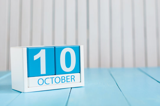 October 10th. Image of October 10 wooden color calendar on white background. Autumn day. Empty space for text