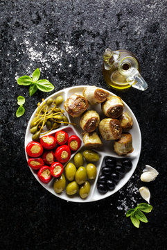 Fototapeta starter of green olives, black olives, capers, buffalo mozzarell