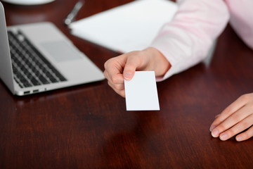 Business woman giving visit card