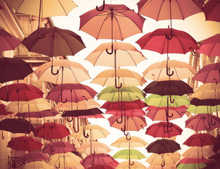 Fototapeta na wymiar hanging umbrellas - vintage color