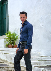 Obraz premium Portrait of handsome bearded man wearing elegant clothes