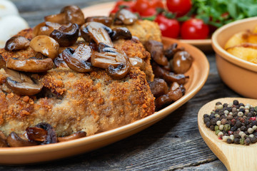 roulade of pork with roasted mushrooms and potatoes