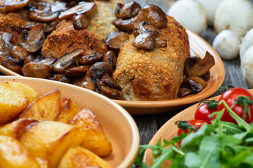 roulade of pork with roasted mushrooms and potatoes