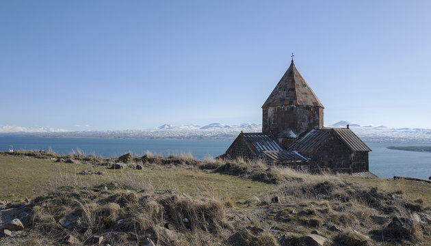 Stunning view on Sevanavank Monastery near of Sevan Lake and snowy mountains
