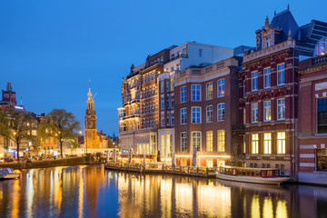 Fototapeta na wymiar Amsterdam clock tower is one of attractions near the flower mark