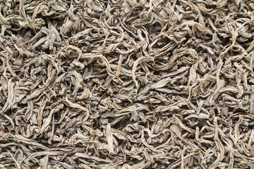Background from dried leaves of Ceylon black tea close up
