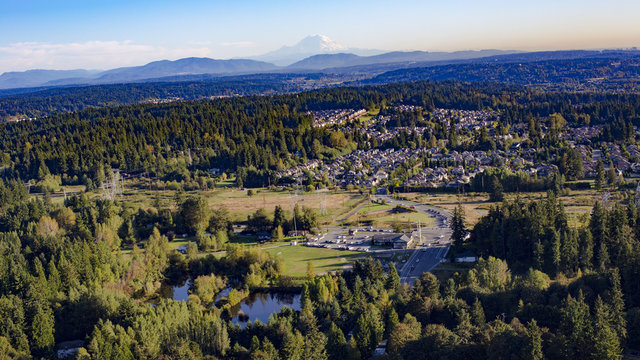 Fototapeta Bothell Mill Creek, Washington Suburban Forest Aerial - Mount Rainier and Cascade Mountains Backdrop