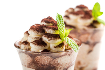 Closeup of tiramisu dessert on a white background