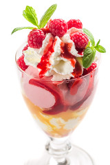 Dessert with raspberry ice cream and whipped cream on a white background