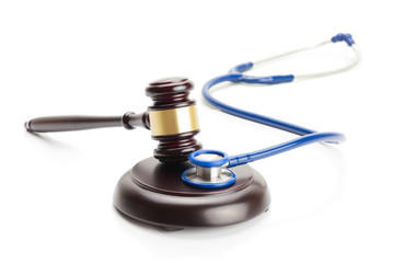 Close up studio shot of judge gavel and stethoscope