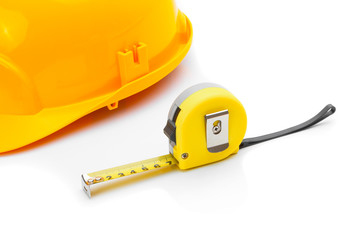 Construction helmet with measure tape on white