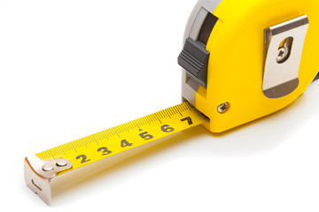 Measuring and calculating instruments - yellow ruler on white