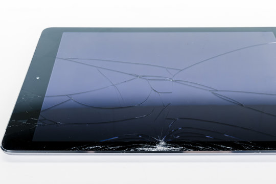 Broken iPad with a shattered glass screen on white background Stock Photo |  Adobe Stock