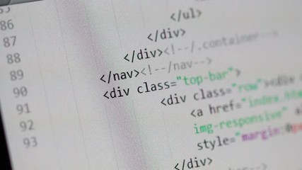 Scrolling through a page of HTML code in a light-color code editor window. Scrolling stops from time to time to show some of the HTML tags