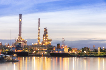 Obraz na płótnie Canvas Oil refinery plant at twilight with copy space.