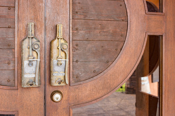 Door knob in vintage style on the wood door.