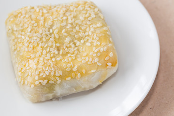 Pie topping sesame serve on white disk for breakfast.