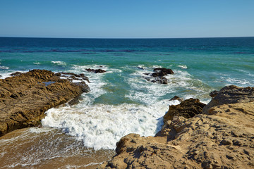 Waves beating against coastal rocks on the cliffs
