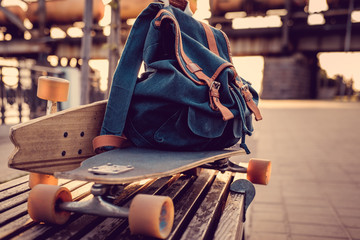 Fototapeta Longboard with backpack on it. obraz