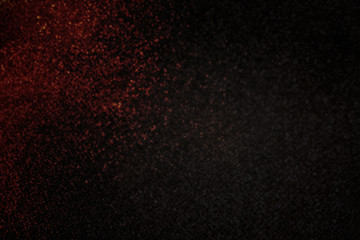 Fototapeta na wymiar Abstract dark red small glitter sparkle bokeh on black for abstract background