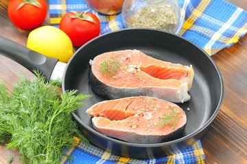 Raw fish in pan prepared for cooking