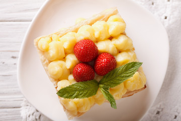 Tasty strawberry millefeuille with custard closeup. horizontal top view 
