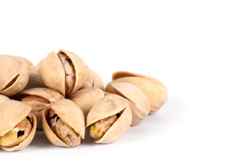 Roasted pistachios on a white