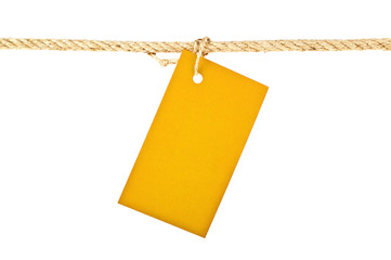 Yellow lable on a rope isolated on white background, closeup
