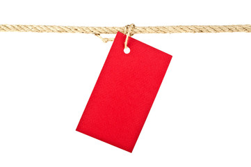 Red lable on a rope isolated on white background, closeup