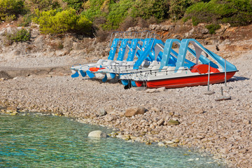 Multicolored catamarans on the beach