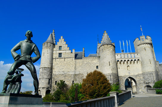 Statue of Lange Wapper and medieval fortress het Steen in the old city center of Antwerp