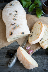 The Italian bread ciabatta with olives
