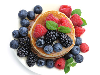 Healthy Breakfast.Pancakes with berries and honey.