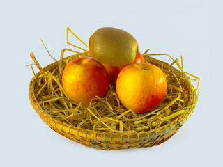 Still life of kiwi and apple in basket isolated on white background,Still life of kiwi and apple in basket isolated on white background