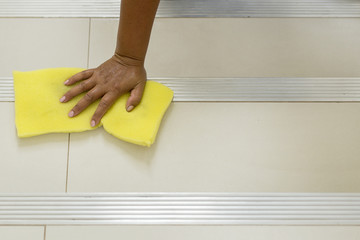 construction worker installing decorative tiles