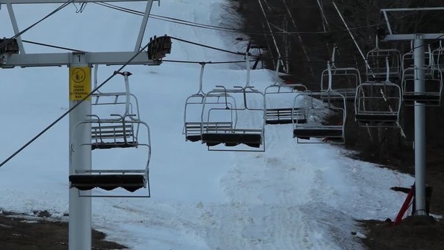 Triple chairlift stopped at ski resort resort