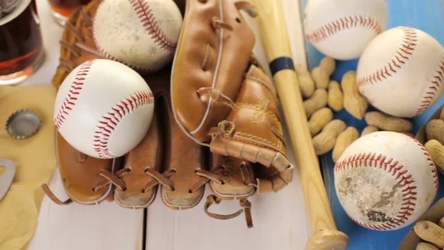Close up of old worn baseball equipment on a wooden background