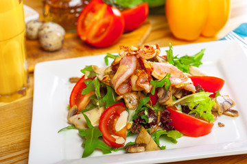 Warm mushroom salad with chilli and tomatoes