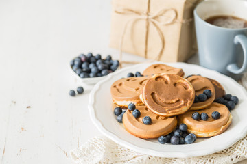 Fathers day concept - pancakes with blueberries and gift