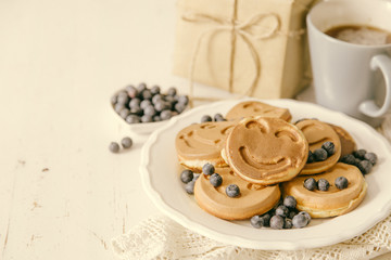 Fathers day concept - pancakes with blueberries and gift