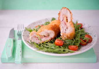 Chicken roll with cheese and fresh vegetables for dinner

