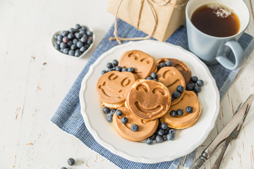 Fathers day concept - pancakes with blueberries and gift