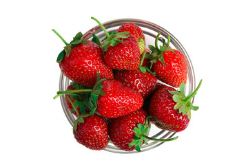 a bunch of ripe delicious strawberries in glass bowl on white isolated background