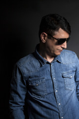 Fototapeta premium Portrait of man in Blue jean shirt with sunglasses