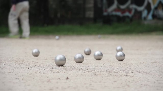 Petanque Boulodrome In Paris, France. Pétanque is a form of boules where the goal is to throw steel balls as close as possible to a small wooden ball called a cochonnet.