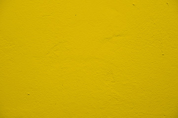 Cement wall,yellow color background