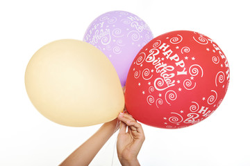 colourfull bolloons in hands