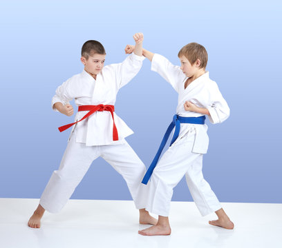 Paired exercise karate are training two boys