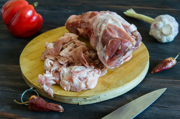 pork leg lying on a cutting board