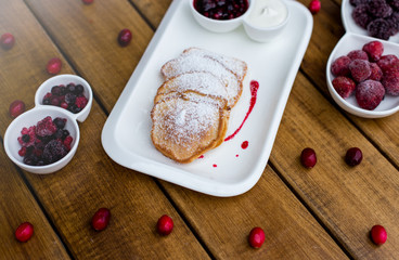 Fototapeta na wymiar Delicious pancakes with raspberries, selective focus
